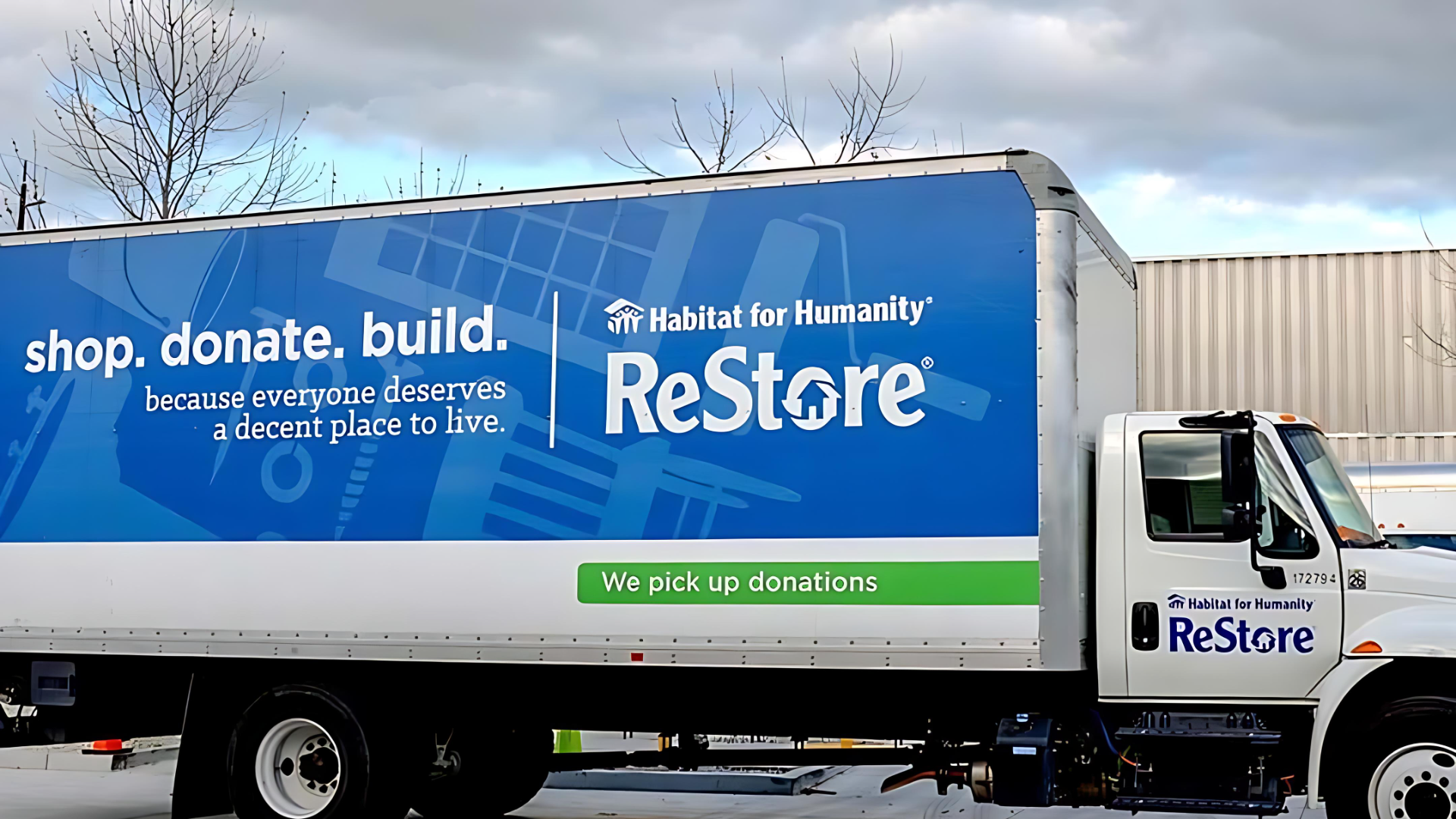 A blue and white branded Habitat for Humanity ReStore Truck