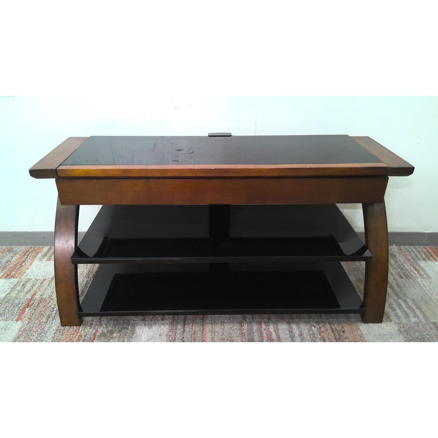 Wooden coffee table with a black glass top, front