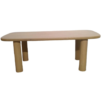 Wooden table with cylindrical legs on a plain background